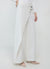 Asymmetrical gold buttoned trousers