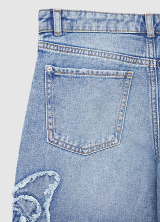 Cropped jeans with butterfly applique
