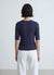 Knitted cable-knit T-shirt with buttons on the shoulders