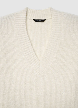 Pull doux à col en V avec dentelle à la base