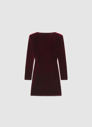 Short dress with draping and brooch