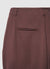 Wide trousers with buttons at the hem