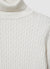 Maglia dolcevita a trecce