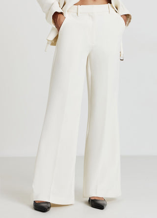 Pantaloni zampa con tasche francesi