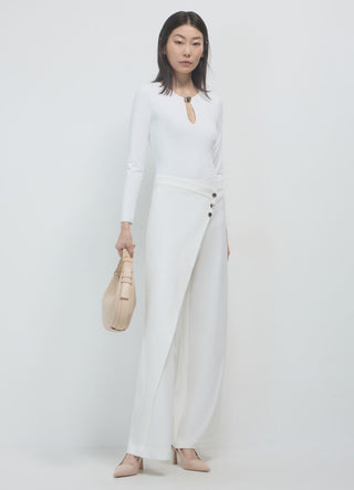 Asymmetrical gold buttoned trousers