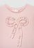 T-shirt con fiocco applicato